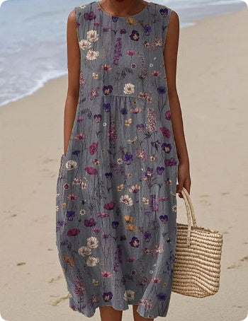 Woman wearing a floral dress on a beach