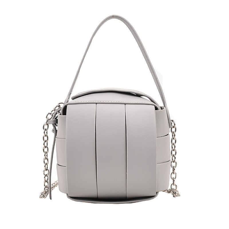 Silver handbag with chain detail on a white background