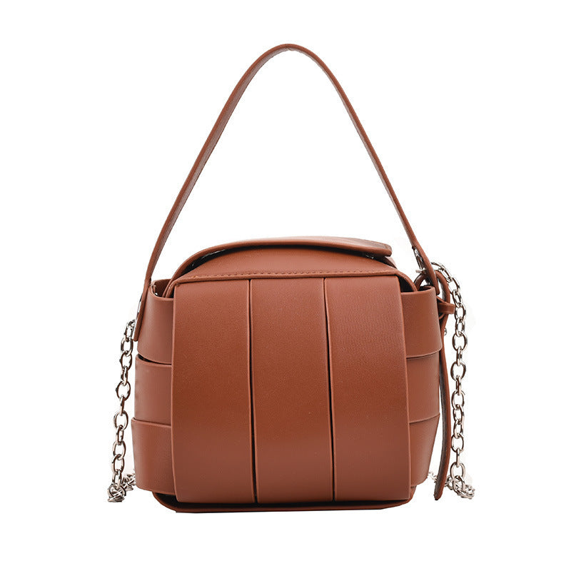 Brown handbag with chain detail on a white background