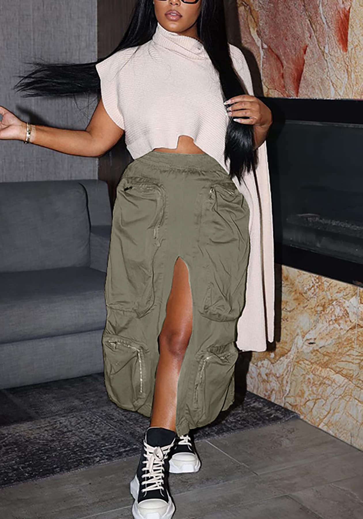 Woman wearing a white top and green cargo pants in a living room setting.