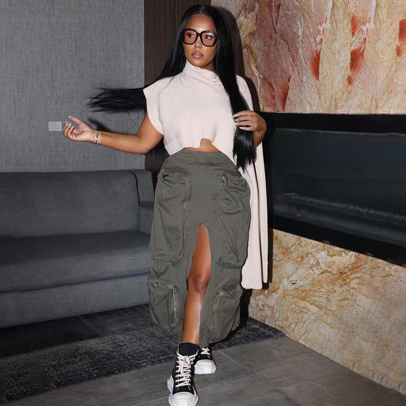 Woman in a stylish outfit with a high slit skirt in an indoor setting