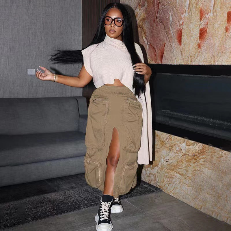 Woman in a stylish outfit with a high slit skirt in an indoor setting
