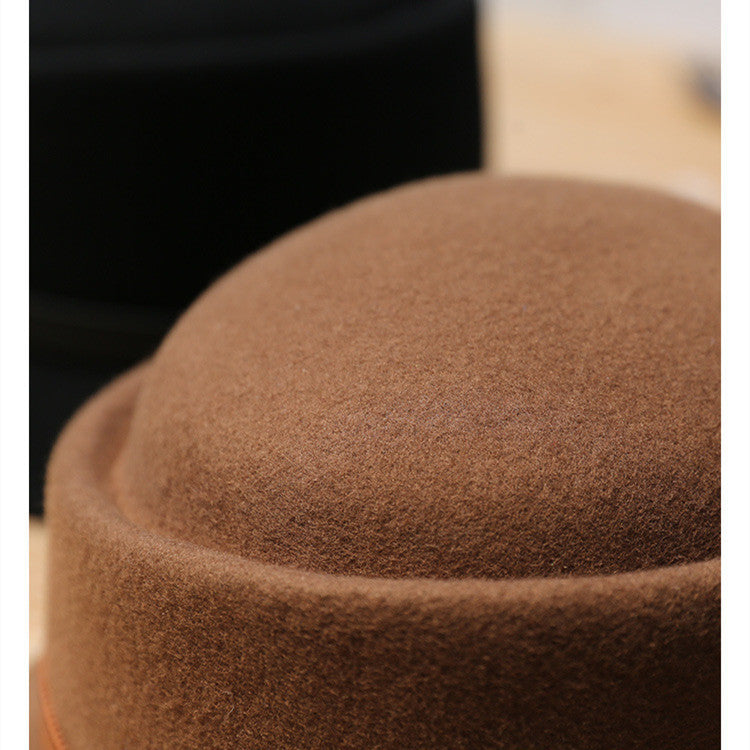 Close-up of a brown felt hat with a blurred background
