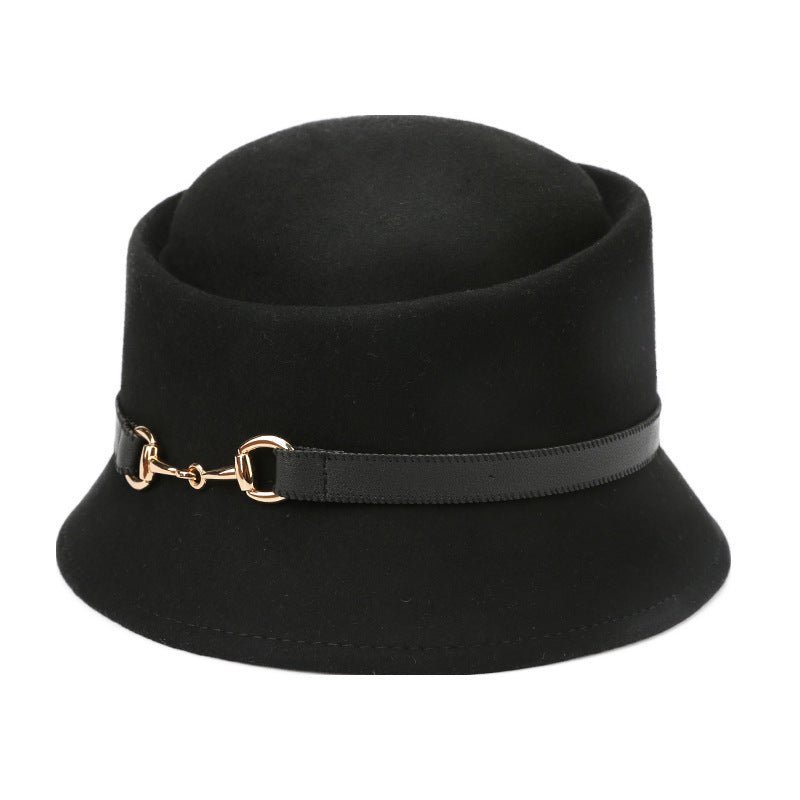Black bucket hat with a gold buckle strap on a white background